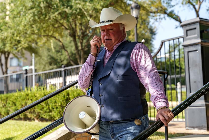 Texas Agriculture Commissioner Sid Miller speaks to a crowd gathered in front of the Governor’s Mansion to protest statewide business closures and mask mandates.