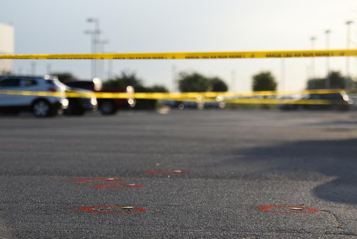 Police tape and evidences are seen as Texas state troopers and other emergency personnel monitor the scene at a local car dealership following a shooting in Odessa, Texas, U.S. September 1, 2019. REUTERS/Callaghan O'Hare