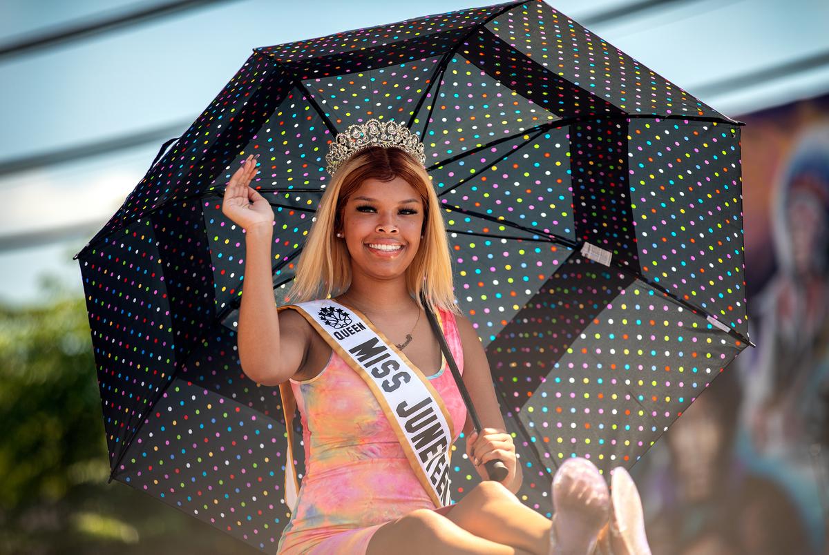 Kennedé Wallace, Austin’s Miss Juneteenth waves to crowds during the annual Juneteenth parade in East Austin on June 19, 2021. Juneteenth commemorates Union Army General Gordon Granger’s proclamation issued on June 19, 1865 in Galveston, which ordered the freedom of more than 250,000 enslaved Black people in Texas who were denied freedom for more than two years after President Abraham Lincoln signed the Emancipation Proclamation. 
