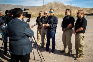 Current Texas Land Commissioner and candidate for attorney general George P. Bush visits the border barrier that separates Sunland Park, New Mexico and Juarez, Mexico alongside National Border Patrol Council labor union reps on Dec. 7, in Sunland Park, NM.