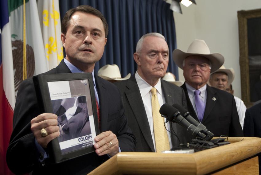 Texas Department of Agriculture Commissioner Todd Staples, holds up copy of recently released independent copy of Texas border security during press conference at Texas Capitol on September 26th, 2011