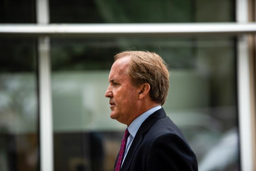 State Attorney General Ken Paxton, right, speaks at a press conference at the Houston Recovery Center on October 26, 2021.