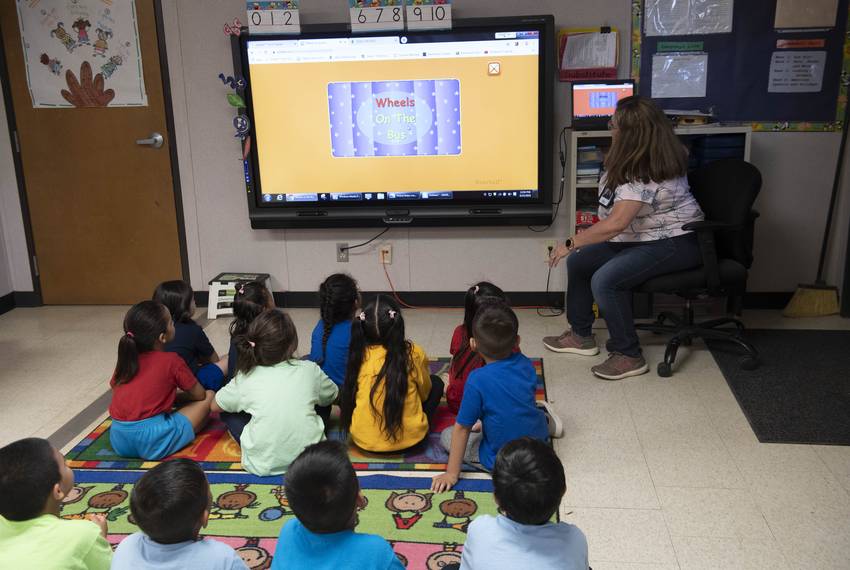 Dilley, TX August 23, 2019: Migrant children from Central American play and attend school classes during the day at the U.S. Immigration and Customs Enforcement's (ICE) South Texas Family Residential Facility's outside Dilley. The 55 acre campus is currently home to about 900 mothers and children awaiting immigration or deportation hearings.