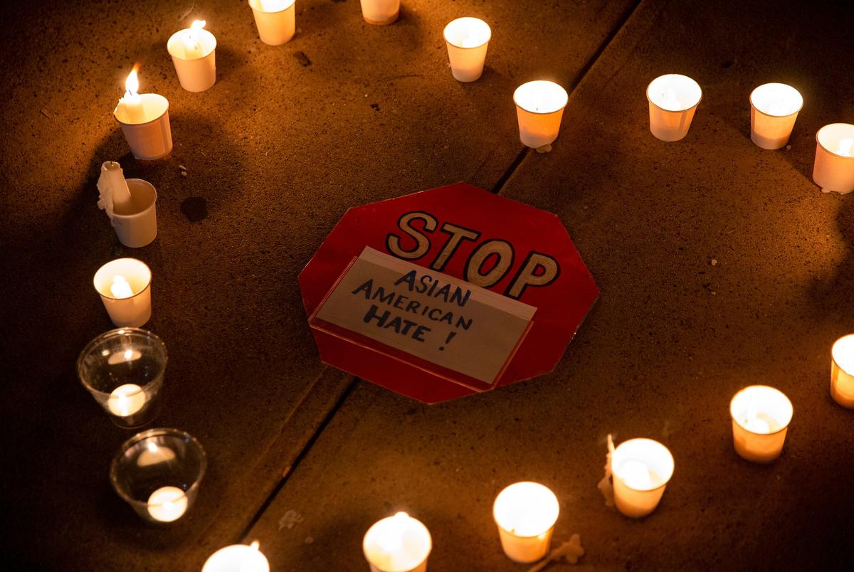 People gathered at the Grassy Knoll in Dallas to honor the victims of the shootings in Atlanta.