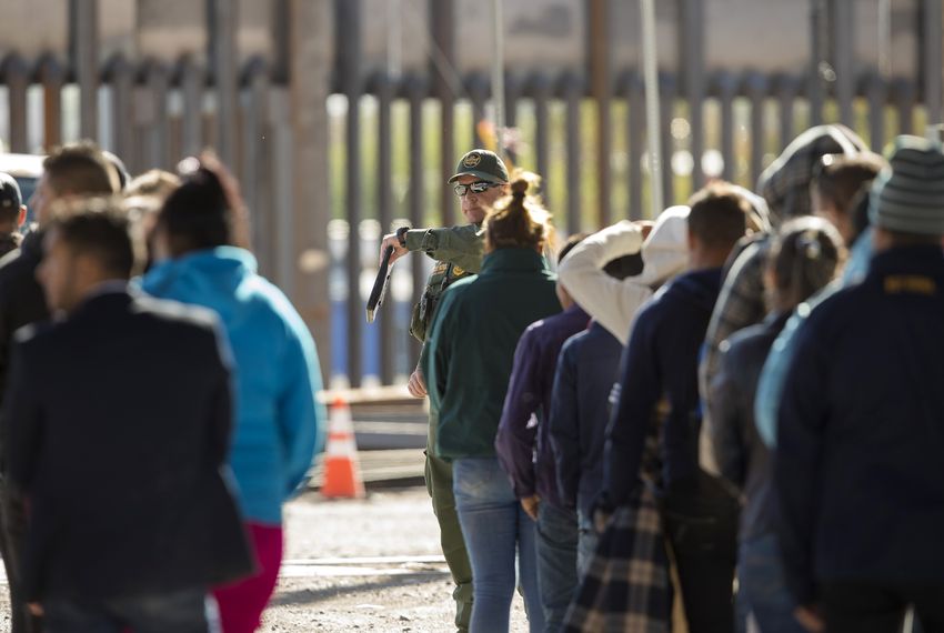 A group of migrants are detained by CBP near the Paso del Norte International Bridge on March 31, 2019.