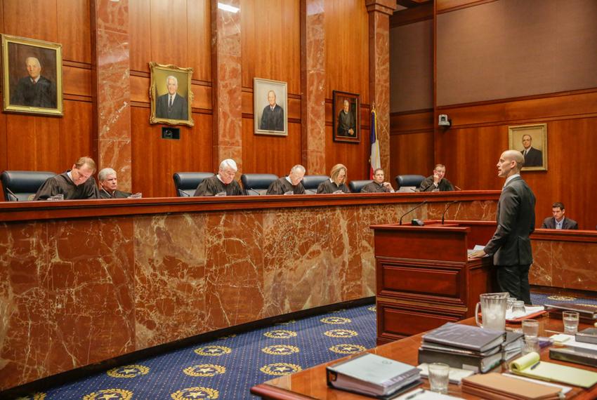 Texas State Solicitor General Scott Keller addresses the state Supreme Court as oral arguments begin in Texas' latest school finance trial at the , Tuesday, Sept. 1, 2015, in Austin, Texas. Attorneys for more than 600 school districts suing Texas argue that the funding is inadequate and unfairly distributed, making it hard for students and schools to meet stringent academic standards. Attorney General Ken Paxton's office counters that, while not perfect, public education money meets state constitutional requirements for an efficient system providing a "general diffusion of knowledge."(AP Photo/Eric Gay)