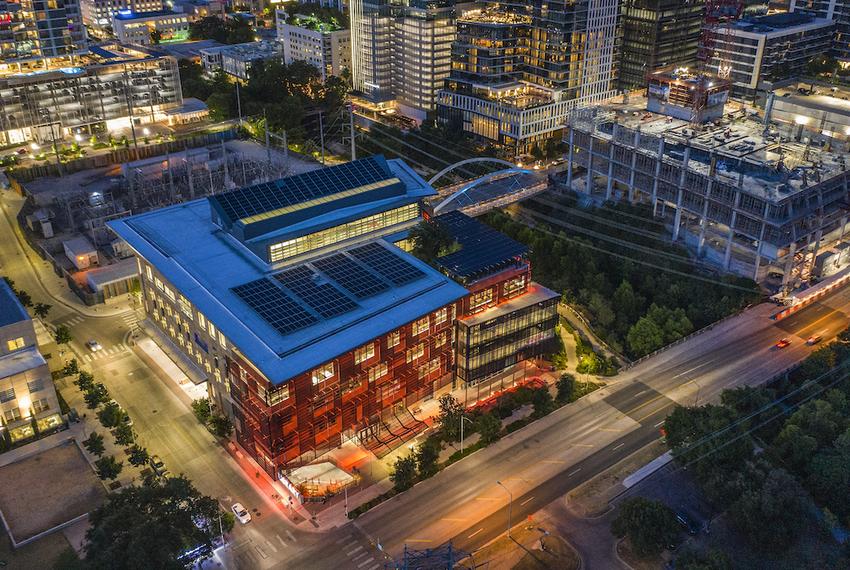 The Austin Central Library, 710 W Cesar Chavez St, Austin, Texas. 

The Austin Central Library was built with energy savings in mind. Solar panels on the roof help power the building throughout the day. Metal scrims on every side but North help filter direct sunlight from flowing directly into the building. The lights inside naturally adjust brighter or darker as the light changes throughout the day.