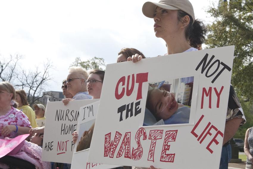 Community home care advocates for children rally on the South steps of the Capitol against budget cuts