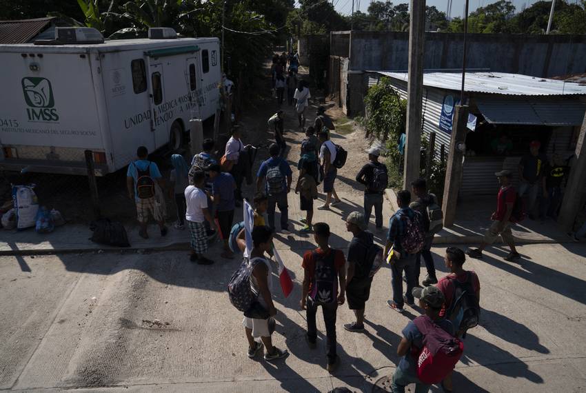 More than 50 migrants, all Honduran with the exception of one Guatemalan, walk to the nearest train station on Oct. 26, 2018, near Palenque, Chiapas. The group will be heading north by traveling on freight trains through México. They decided to travel as a group to be better protected from thieves, police, and Mexican immigration officers. Some say they will eventually join the migrant caravan that is currently traversing México with around 4,000, while others say it is better to do it in small groups. At least 800 more troops will be deployed to the U.S.-Mexico border as the migrant caravan keeps traveling north.