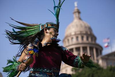 San Antonio resident Rosie Torres perform a Danza Mexica prayer offering on the Capitol South Lawn on May 22, 2019 as part of the Society of Native Nations' first annual Indigenize the Texas Capitol Day.