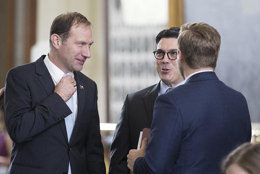 Sen. Charles Schwertner, R-Georgetown, visits with State Rep. Chris Paddie, R-Marshall, after Senate passage of HB 100, which would regulate ride-hailing companies statewide.  