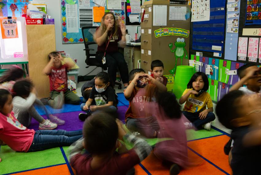 Michelle Cardenas tells the class to quiet down during a literacy lesson on Apr. 27, 2022. Once they quieted down, they could hear the other classroom chant, too. Hillcrest Elementary School split Cardenas' class into two rooms. The class size limit in Texas is 22 students for pre-k through fourth grade, according to Texas Education Code, and Cardenas’ class had reached 30 students. “The more kids you have in there, the harder it is to get stuff accomplished," Cardenas said. “It was literally like babysitting.”