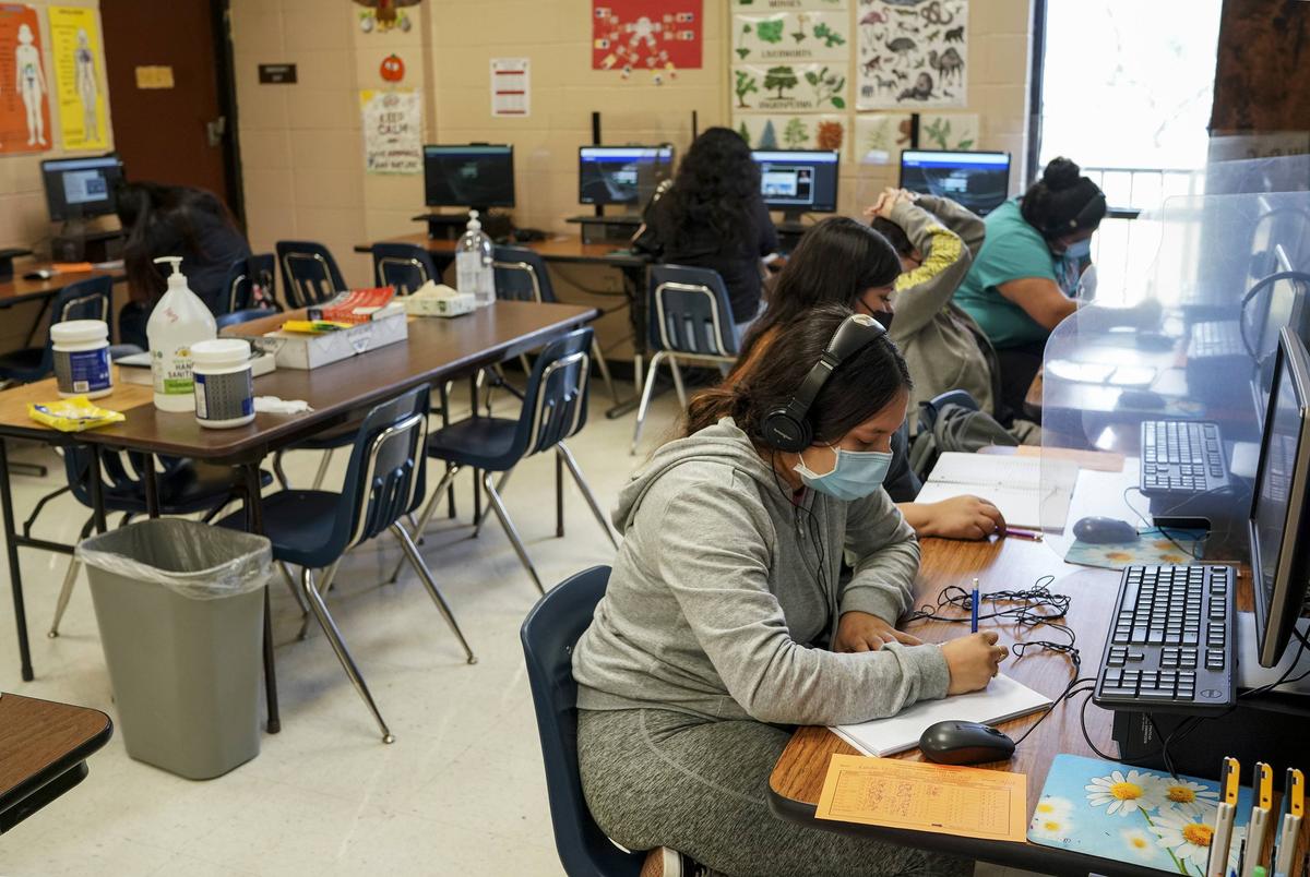 Students take computer tests at Lincoln Park School, in Brownsville, Texas on Wednesday, Feb. 16, 2022. The school for students that are pregnant or have had a baby currently has 69 students enrolled.Verónica G. Cárdenas for The Texas Tribune