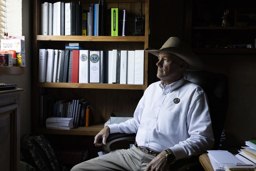 Sheriff Roy Boyd sits for a portrait in his office in Goliad County on May 7, 2025.