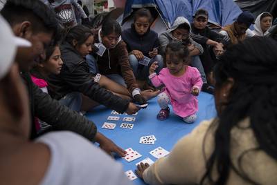 Asylum seeking teenagers learn about factors with poker cards during a class taught by volunteers from the U.S. near the Gateway International Bridge in Matamoros, Mexico on Sunday, Oct. 13, 2019. The kids are not attending school and Sundays are the only days they get to learn from teachers and volunteers.
Verónica G. Cárdenas for The Texas Tribune