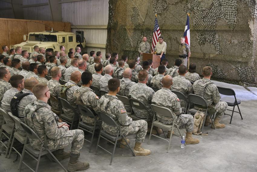 Governor Rick Perry gives a pep talk to National Guard troops training for deployment to the Texas border at Camp Swift on August 13, 2014.