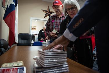 Danny Randolph waits in line to purchase his copy of KCarl Smith’s engagement strategy book for 15 dollars after listening to the speaker at a Black Voices for Trump event, a nationwide initiative to sway voters, at the McLennan County Republican Headquarters in Waco on Feb. 26, 2020.