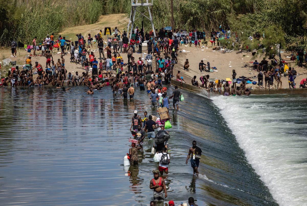 Migrants cross the Rio Grande between Del Rio and Cuidad Acuna, Mexico on Sept. 16, 2021.