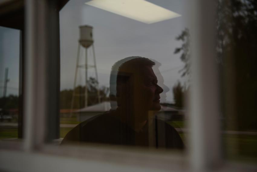 Lyndon Hallmark, the mobile health center manager, poses for a portrait as patients receive healthcare at a mobile health clinic in Kirbyville, Texas, U.S., on Monday, October 17, 2022.