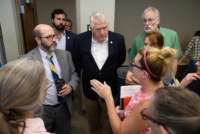 Secetary of State John Scott listens to members of the public while they ask questions about the voting during a state-mandated logic and accuracy test at the Hays County Government building in San Marcos on Sept. 21, 2022. Questions mainly revolved around the saftey of the procedure of the voting machines, and the precautions the department was taking to elliminate errors within the counting process.