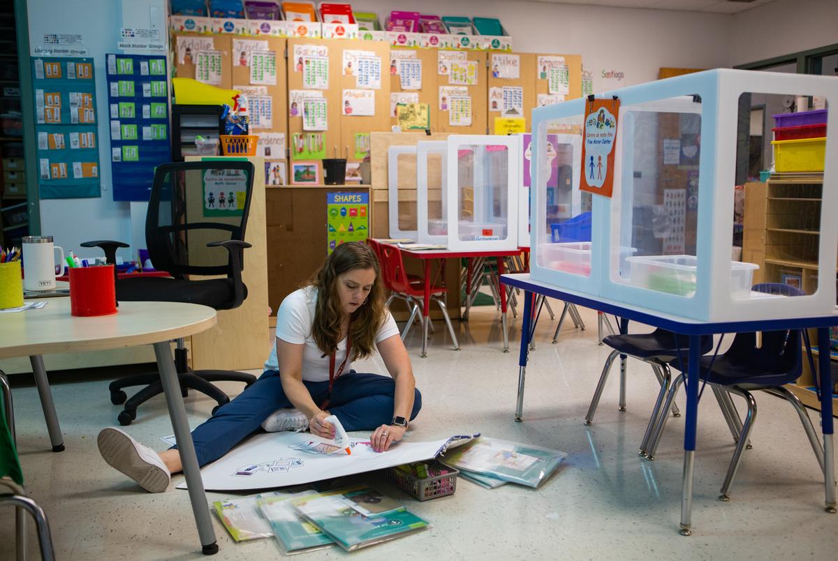 Michelle Cardenas prepares classroom materials for herself and Alejo before the students come into the classroom on Apr. 21, 2022. Cardenas makes two copies of all materials, one for her class and one for Alejo's class. Cardenas had 20 students in her class and Alejo had 10.